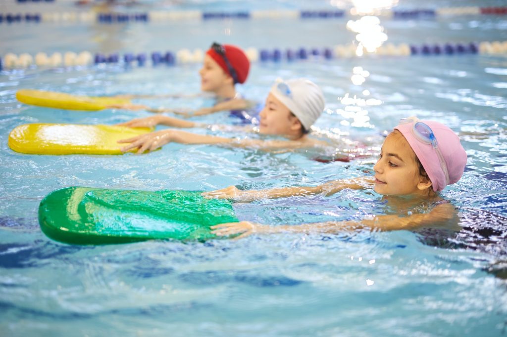 Children learning to swim